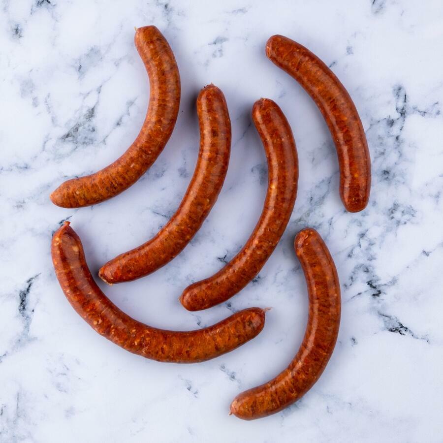 lamb merguez sausage on marble background