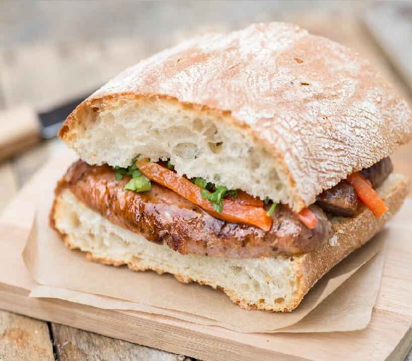 Rustic Sausage Sandwich with Burnt Peppers & Cumin Recipe Online. Deep