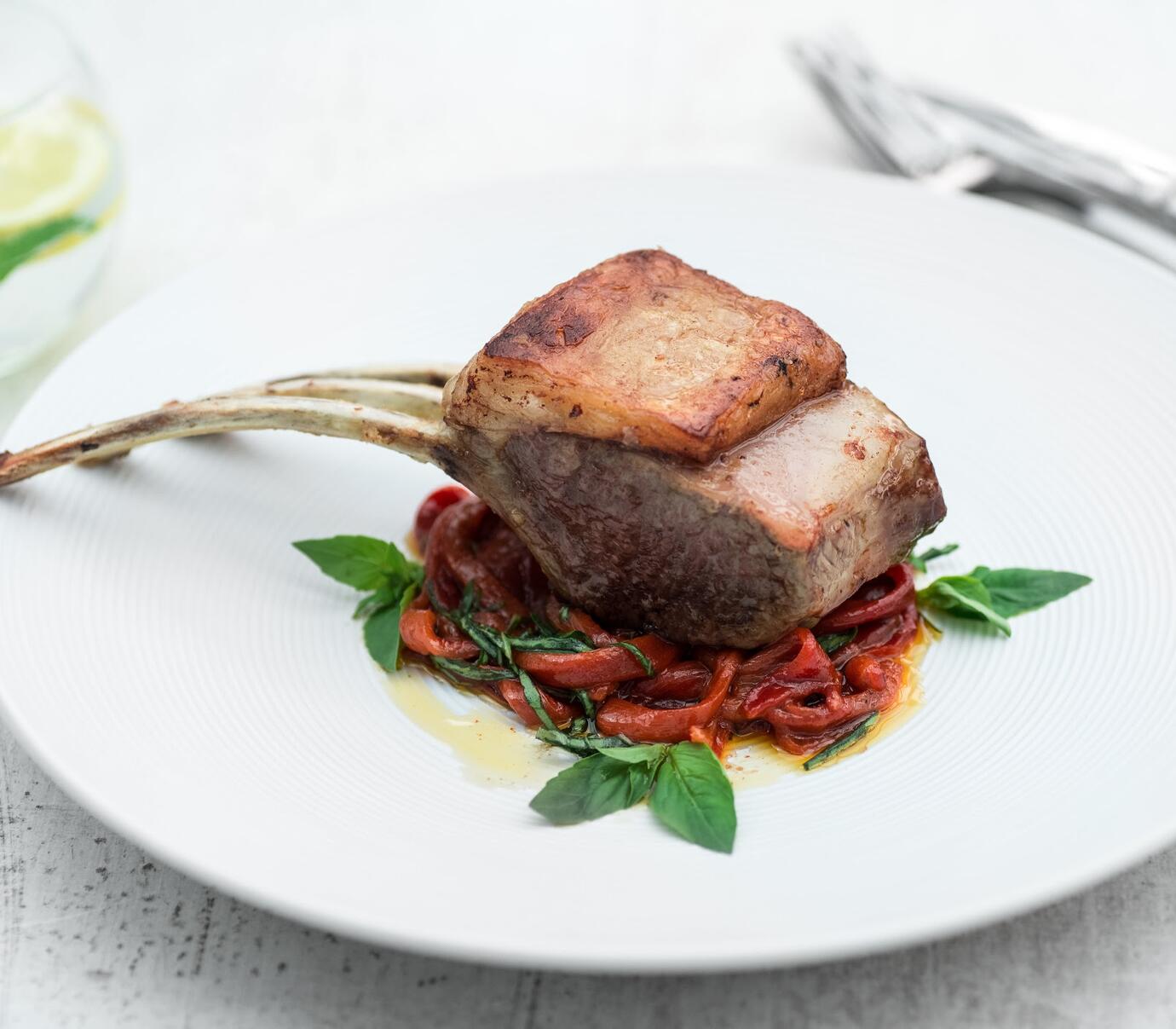 On the bone for maximum flavour, these mini lamb racks taste delicious with red peppers and basil pi