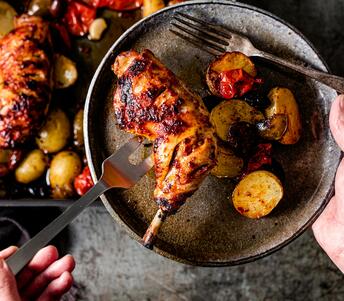 cooked chicken traybake with harissa, olives & potatoes